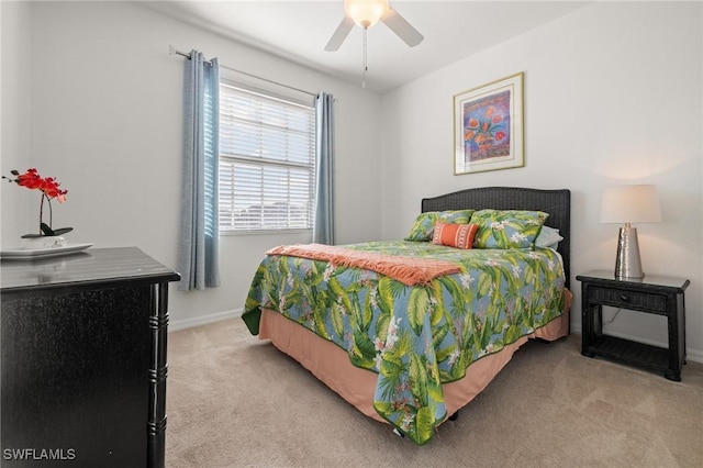 bedroom with light carpet and ceiling fan