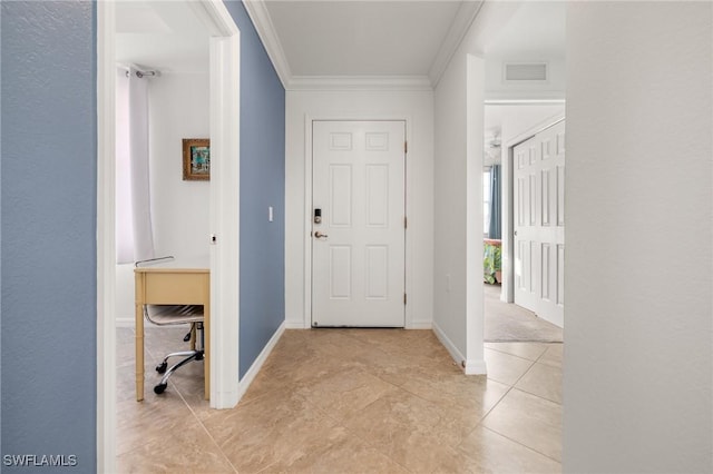 tiled foyer with ornamental molding