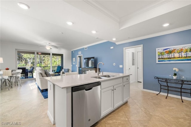 kitchen with ceiling fan, white cabinetry, dishwasher, sink, and an island with sink