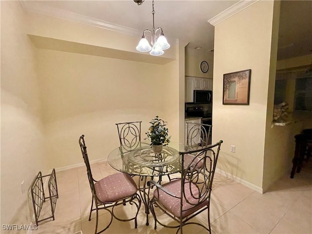 tiled dining area featuring ornamental molding and a chandelier