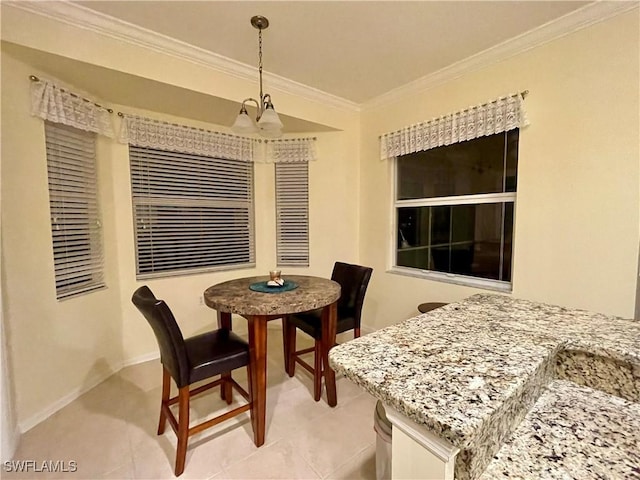 dining space with a notable chandelier, light tile patterned flooring, and crown molding