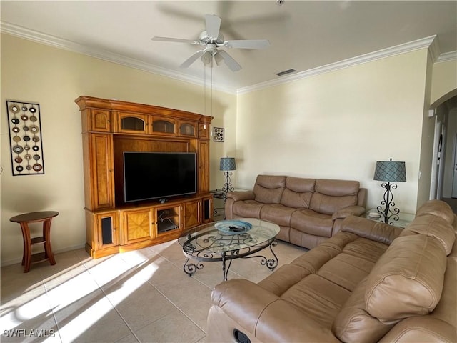 living room with ceiling fan, light tile patterned flooring, and ornamental molding