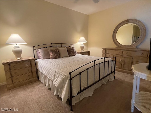 bedroom featuring light colored carpet and ceiling fan