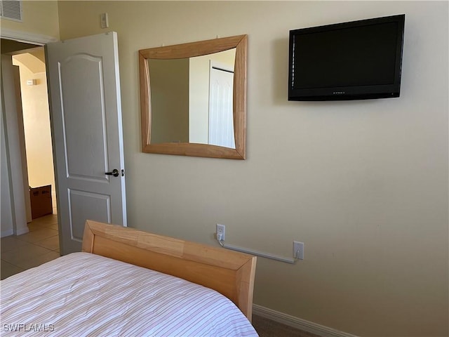 bedroom featuring light tile patterned floors