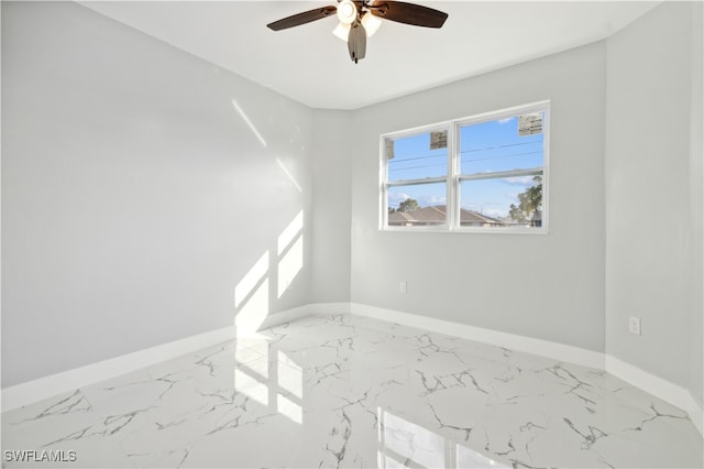 spare room featuring ceiling fan