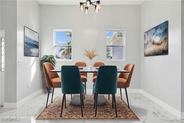 dining room featuring an inviting chandelier and plenty of natural light