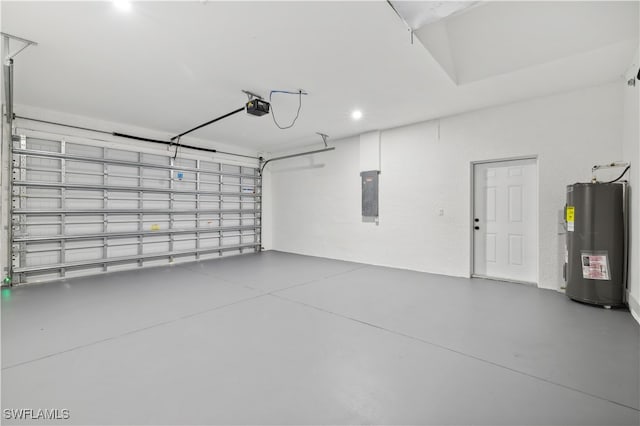 garage featuring water heater, a garage door opener, and electric panel