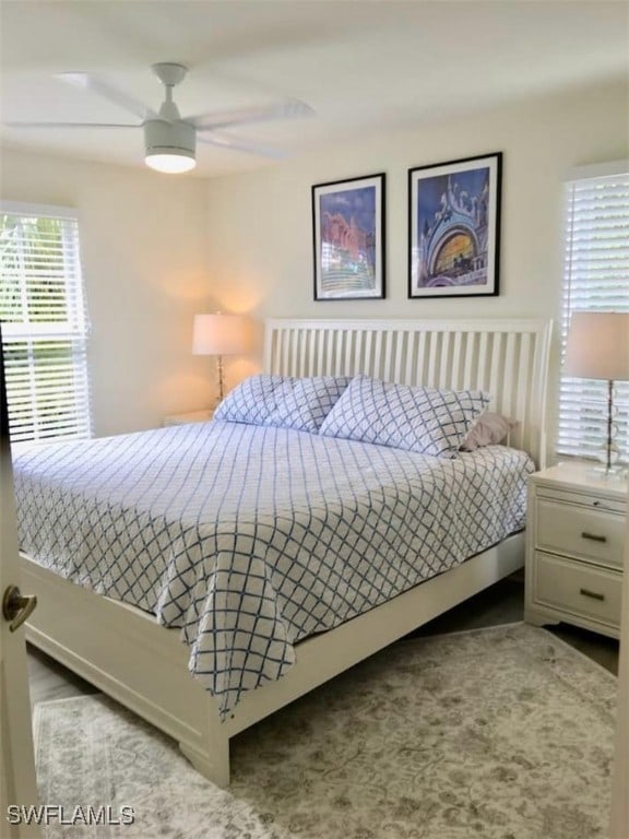 carpeted bedroom featuring ceiling fan