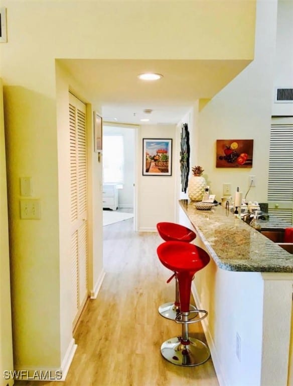 hallway featuring light hardwood / wood-style flooring