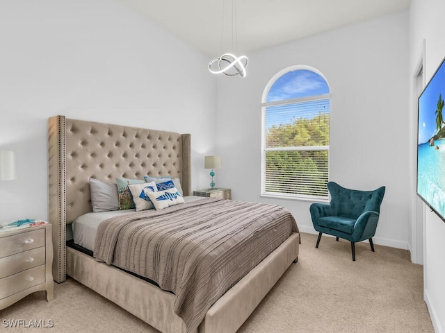 bedroom featuring light carpet