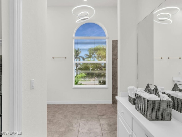 interior space with vanity and tile patterned floors