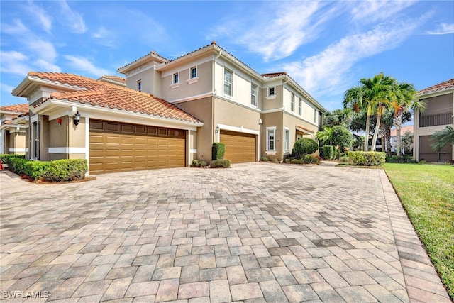 mediterranean / spanish-style home featuring a garage