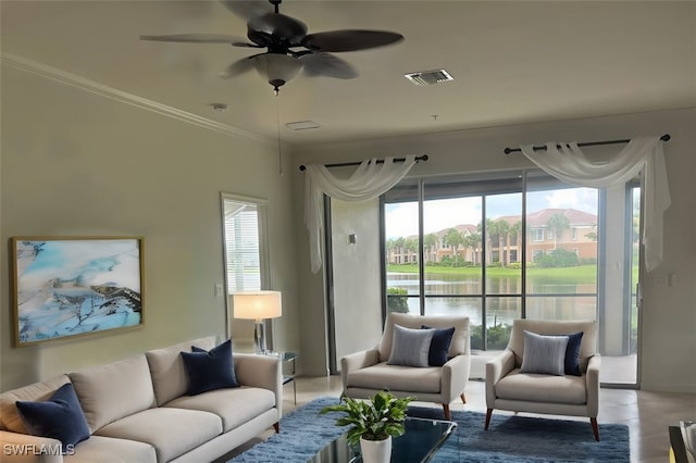 living room featuring crown molding, ceiling fan, a water view, and plenty of natural light