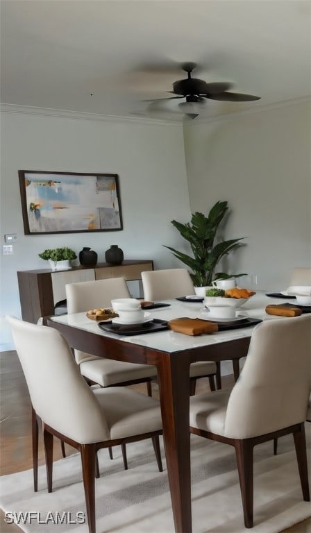 dining area featuring crown molding and ceiling fan