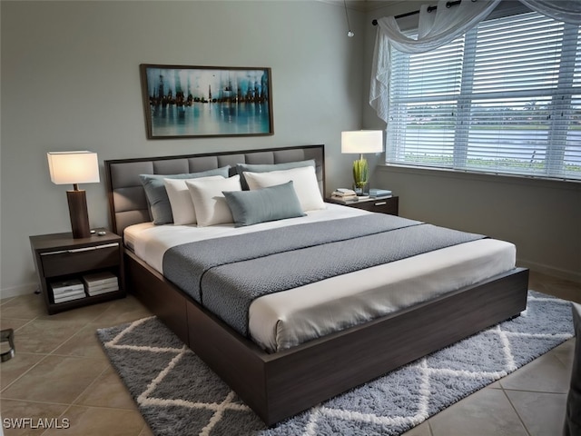 bedroom featuring light tile patterned floors