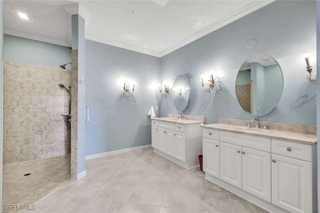 bathroom featuring vanity, tiled shower, ornamental molding, and tile patterned flooring