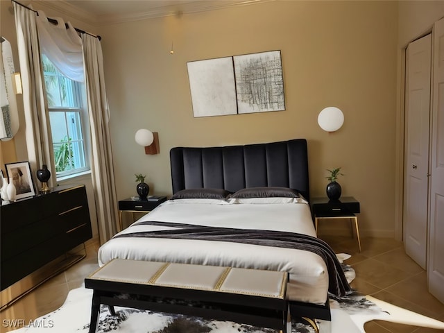 tiled bedroom featuring ornamental molding