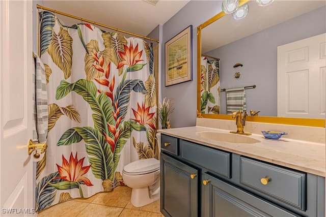 bathroom featuring toilet, a shower with curtain, vanity, and tile patterned flooring