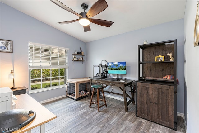 office with lofted ceiling, wood-type flooring, and ceiling fan