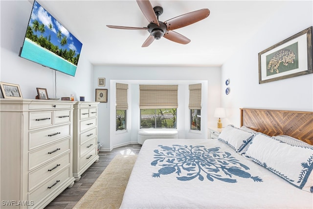 bedroom featuring dark wood-type flooring and ceiling fan