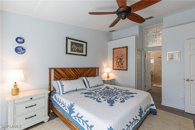 bedroom featuring ensuite bathroom, light wood-type flooring, and ceiling fan