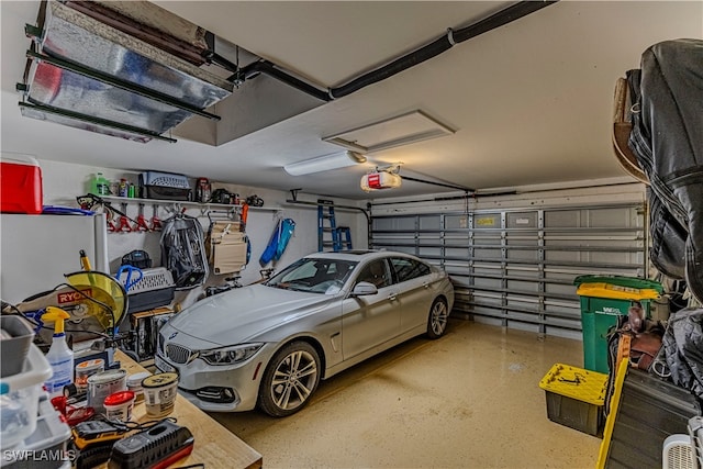 garage featuring a garage door opener