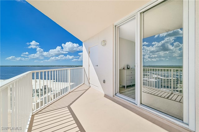 balcony featuring a water view