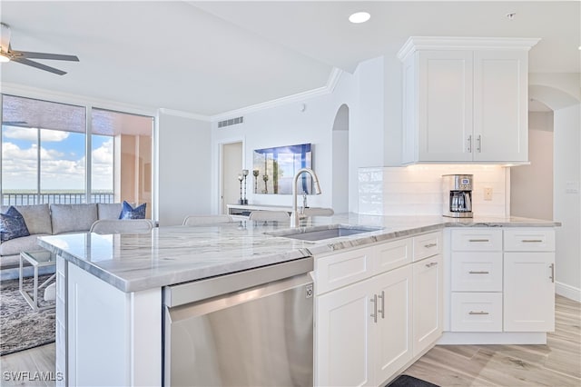 kitchen with white cabinetry, light wood-type flooring, sink, and stainless steel dishwasher