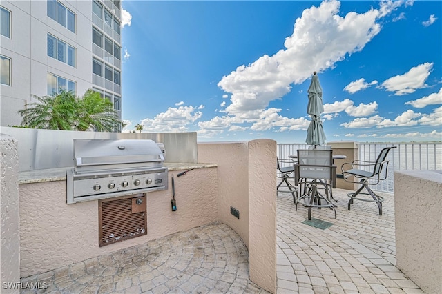 view of patio with area for grilling and grilling area