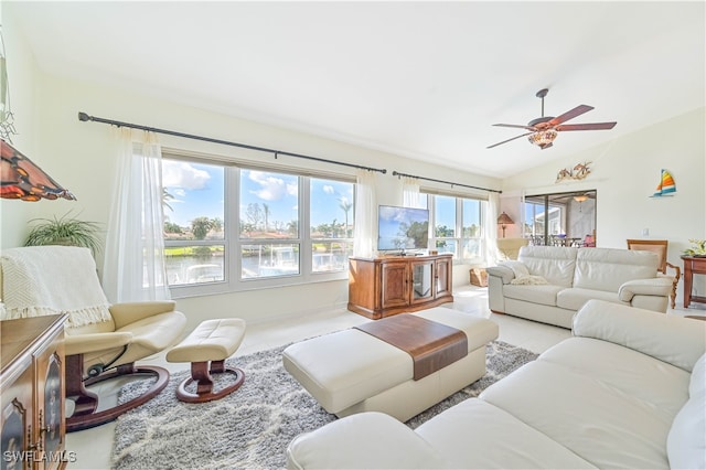 living room with lofted ceiling and ceiling fan