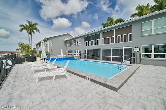 view of swimming pool featuring a patio