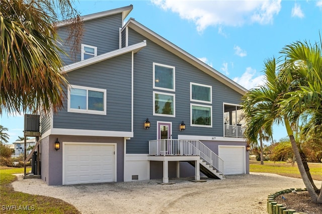 rear view of property with a garage