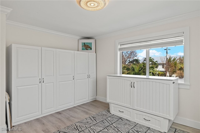 unfurnished bedroom with light wood-type flooring and ornamental molding