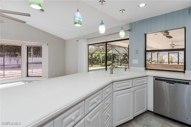 kitchen with dishwasher, white cabinetry, a healthy amount of sunlight, and lofted ceiling