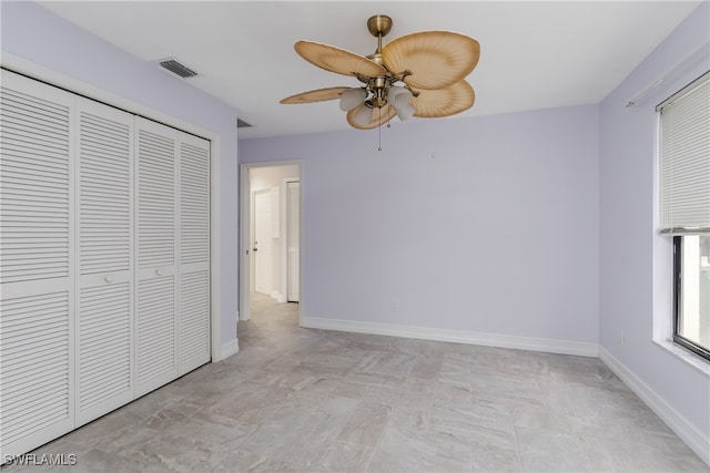 unfurnished bedroom featuring a closet and ceiling fan