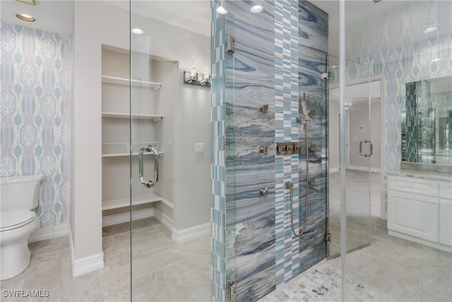 bathroom with toilet, an enclosed shower, and vanity