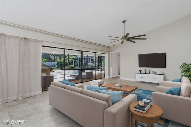 living room featuring ceiling fan and vaulted ceiling