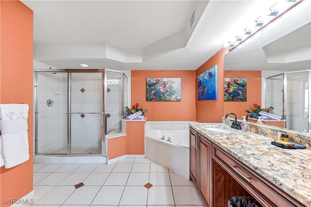 full bath featuring a garden tub, visible vents, a stall shower, vanity, and tile patterned flooring