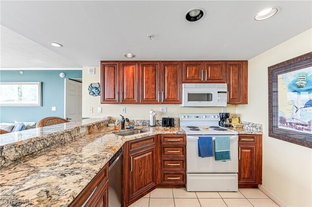 kitchen featuring light tile patterned floors, recessed lighting, a sink, light stone countertops, and white appliances