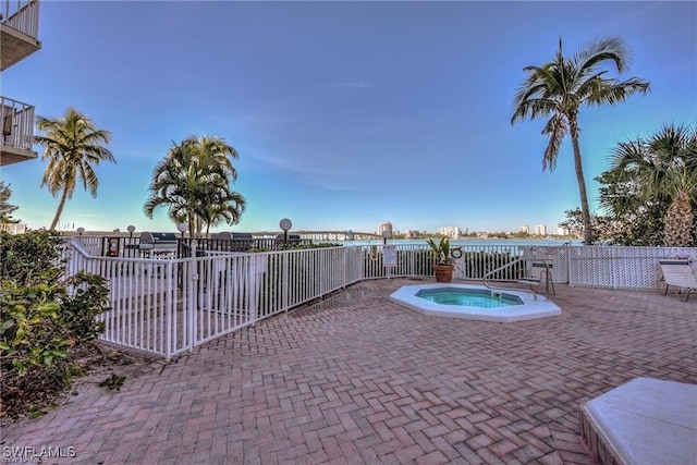 view of swimming pool with a patio area and a community hot tub