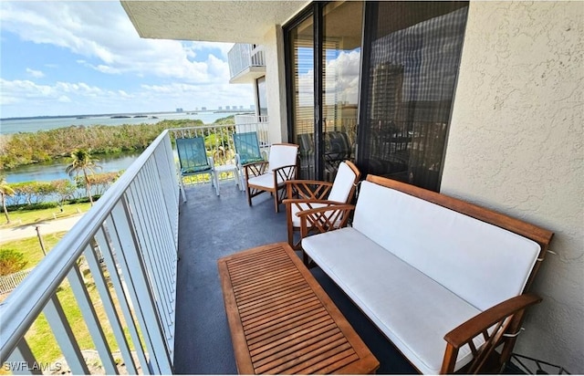 balcony featuring a water view