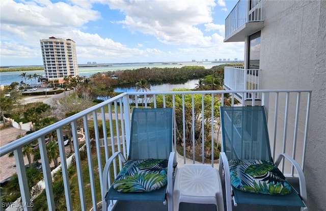 balcony featuring a water view