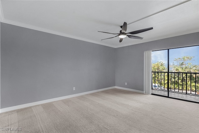 empty room featuring crown molding, light colored carpet, and ceiling fan