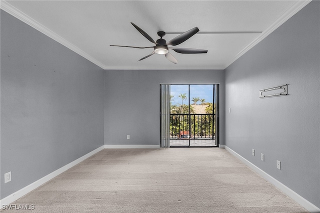 empty room featuring ornamental molding, light carpet, and ceiling fan