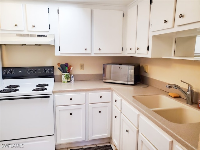 kitchen featuring white electric range oven, sink, ventilation hood, and white cabinetry