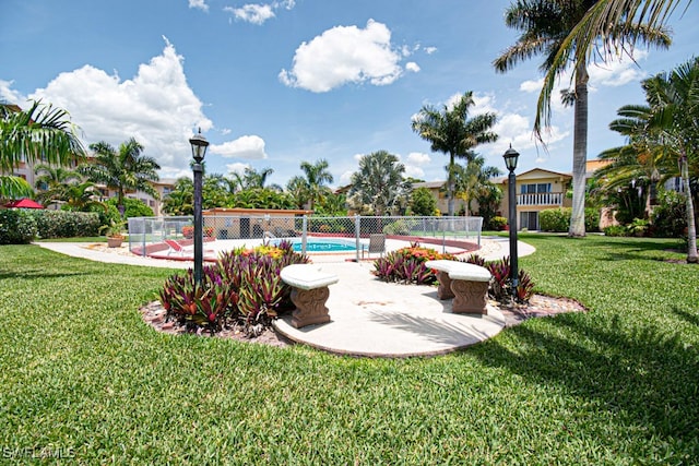 view of yard with a fenced in pool