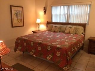 bedroom with light tile patterned floors