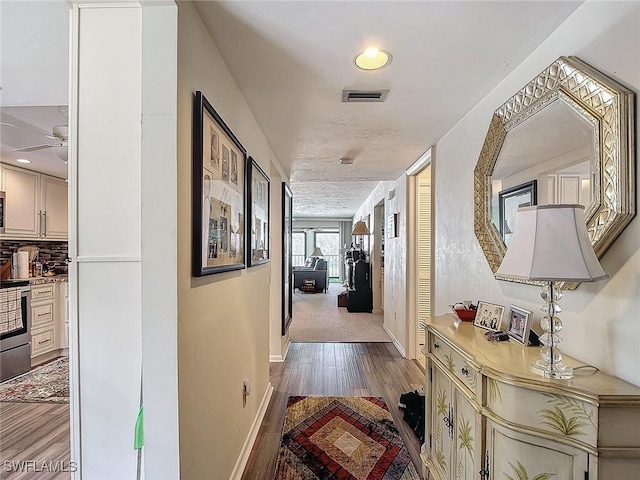 800 Misty Pines Cir Unit H-201, Naples, FL 34105 - corridor with wood finished floors and baseboards