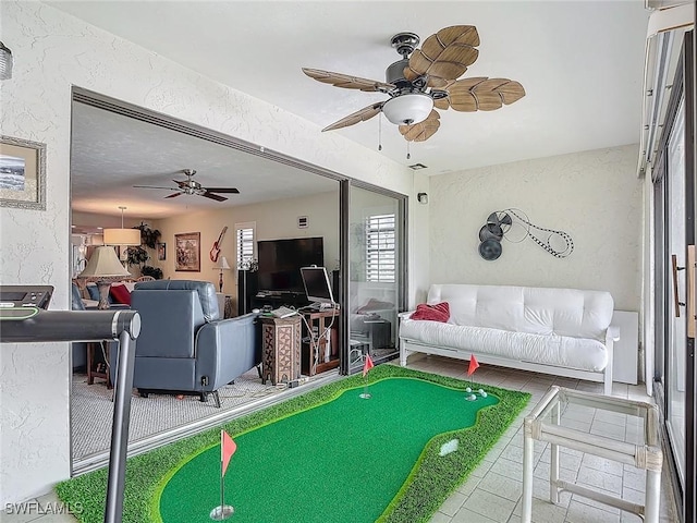 800 Misty Pines Cir Unit H-201, Naples, FL 34105 - living room with a textured wall and ceiling fan