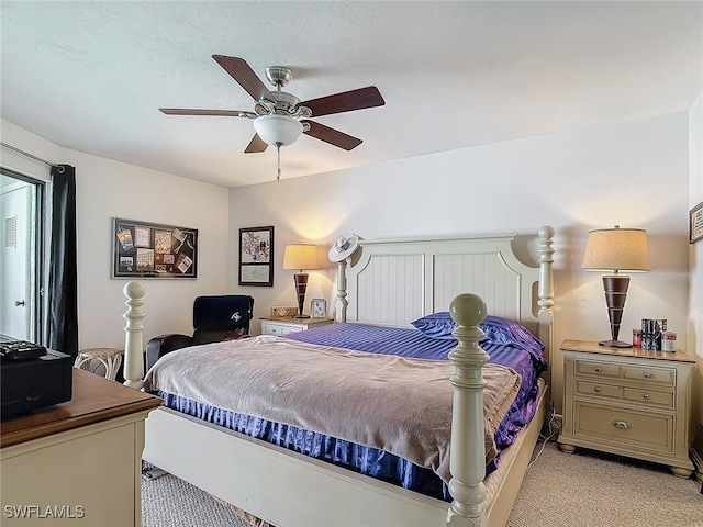 bedroom featuring ceiling fan and light colored carpet